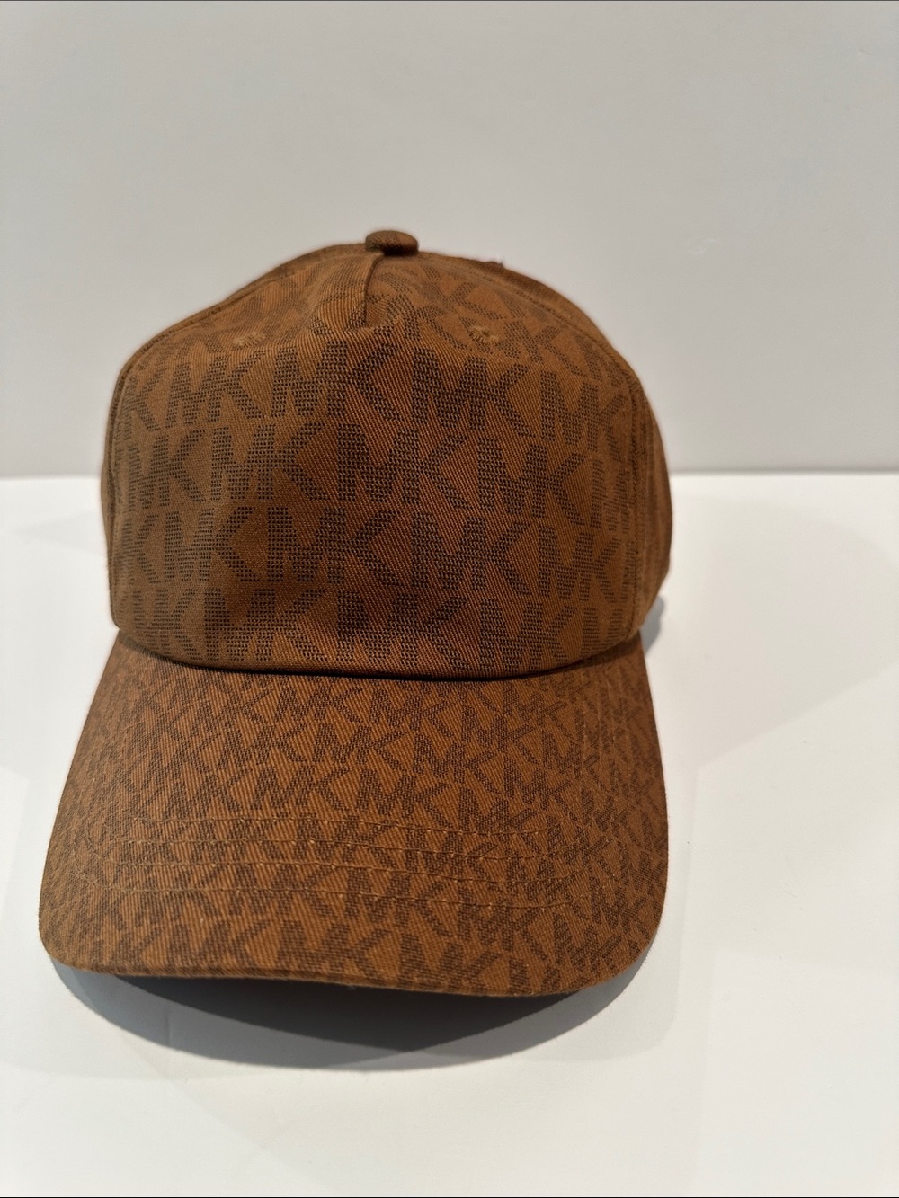 NWT Michael Kors Signature fabric brown cap with adjustable back.